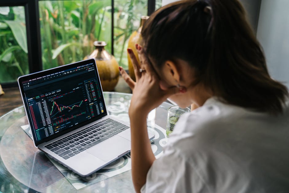 An image showing a person analyzing financial data on a computer screen, with charts and graphs indicating positive trends and growth.